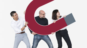 Group of diverse friends holding magnet icon