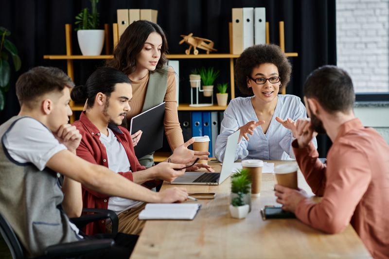Business team discussing workplace communication and employee feedback during a meeting.