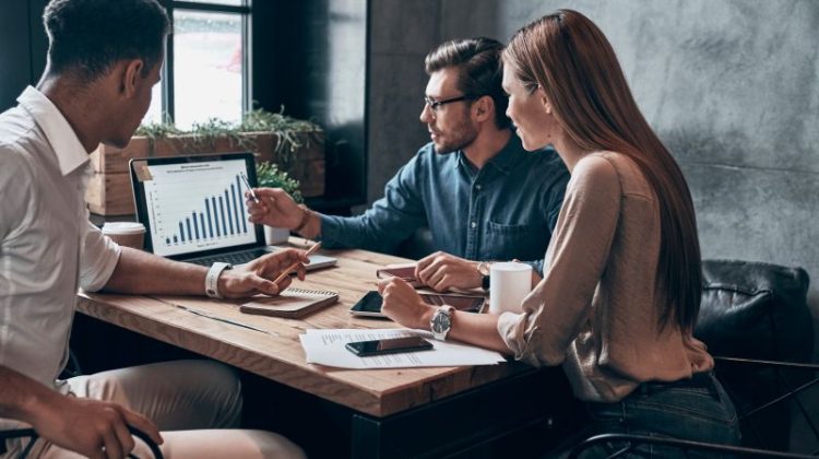 Business professionals reviewing a growth strategy focused on customer acquisition, average order value and repeat purchases