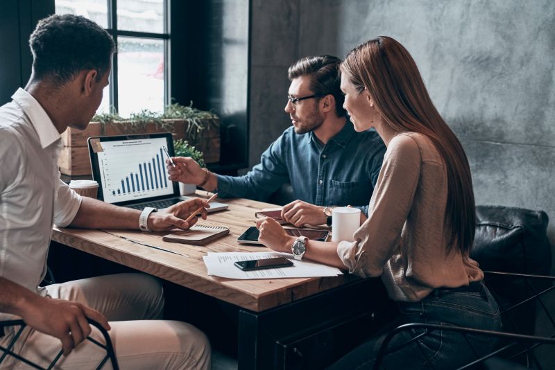 Business professionals reviewing a growth strategy focused on customer acquisition, average order value and repeat purchases