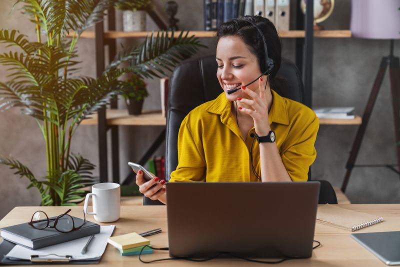 Small business owner meeting with a virtual assistant during an online video call