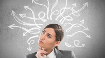 Woman thinking - concept of lots of ideas coming from her mind