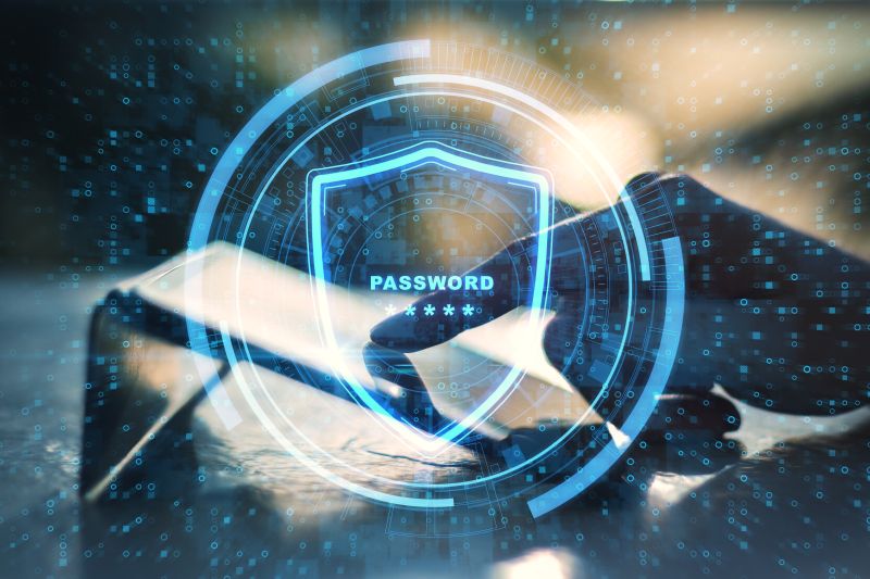 Close Up Of Hands Pointing At Tablet With Glowing Protection Shield On Blurry Outdoor Background