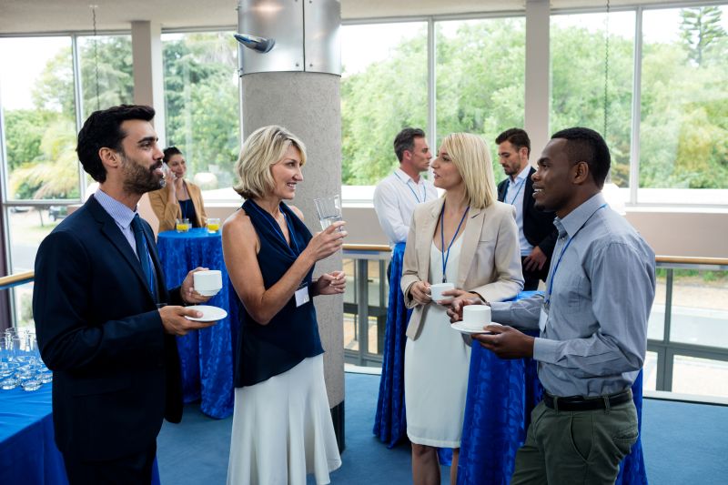 Business Professionals Gathering at Corporate Event