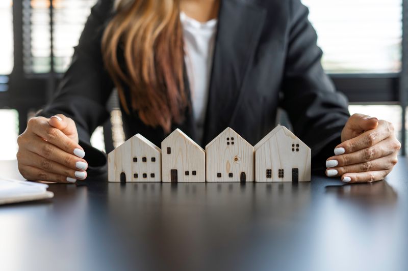 Real estate agents are supporting a model home to offer home insurance