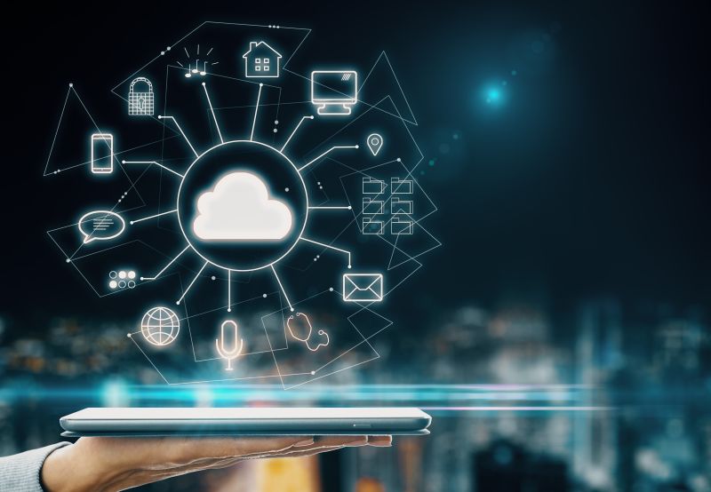 Hand Holding Tablet With Glowing Cloud Interface On Dark Night City Background Background.