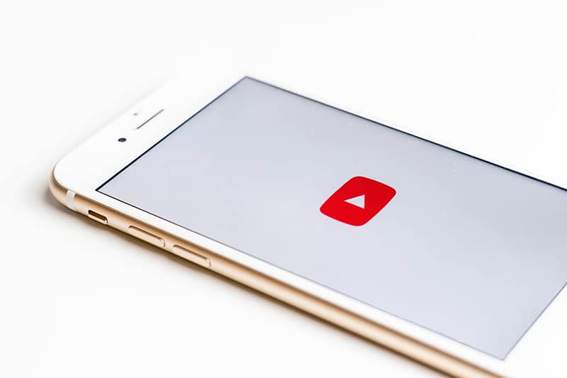 YouTube video play button on mobile phone screen