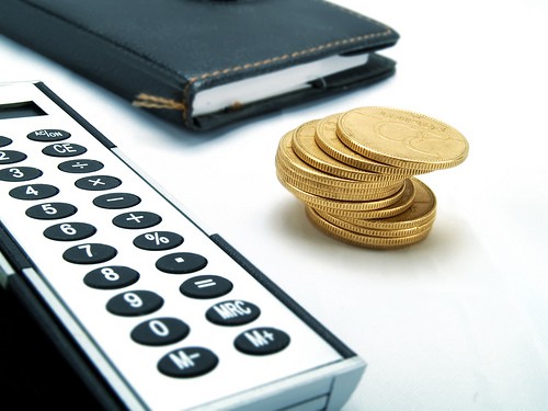 notebook, coins and calculator