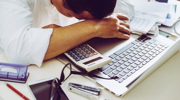 Accountant businessman working in office having a stress.