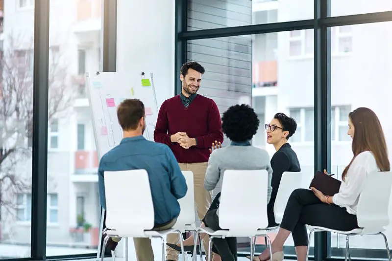 Cropped shot of a businessman giving a presentation to his colleagues in a modern office