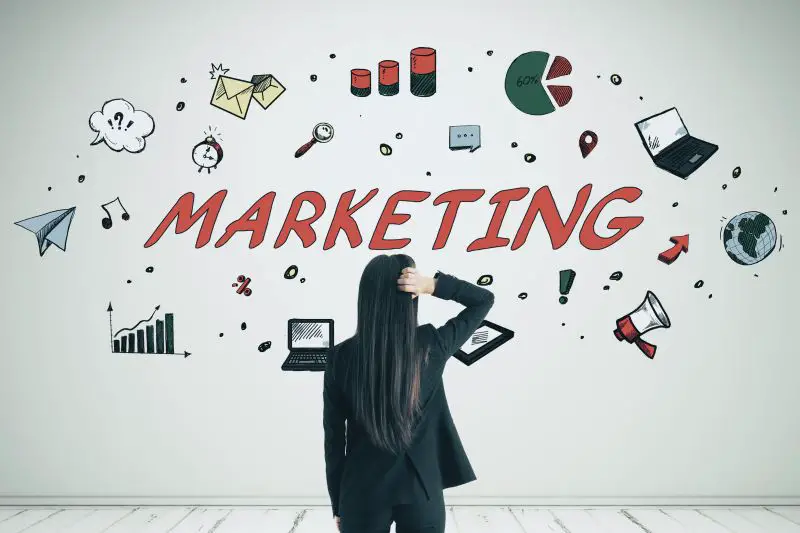 Stressed Young Businesswoman Looking At Marketing Sketch On White Wall Background With Icons