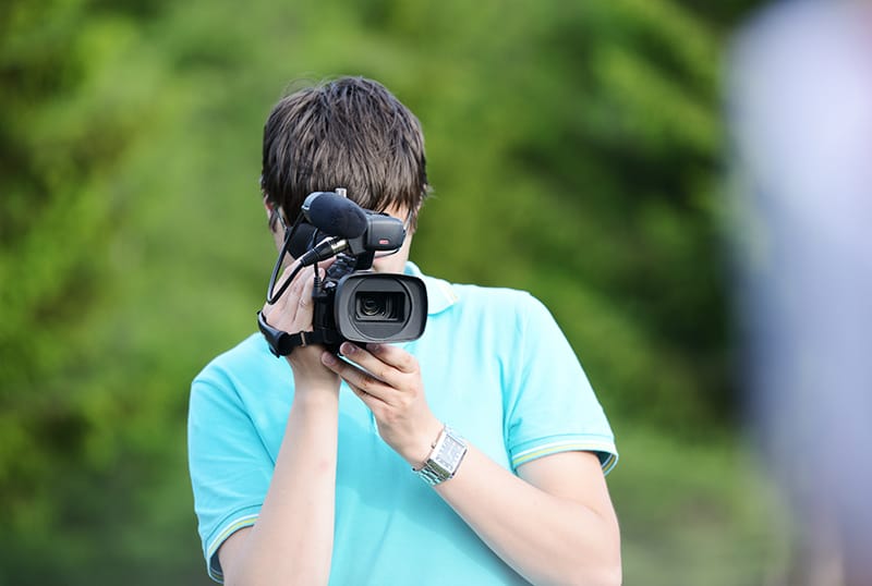 Cameraman filming outdoor