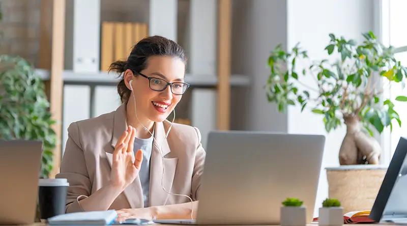 Happy casual beautiful woman working on a laptop,