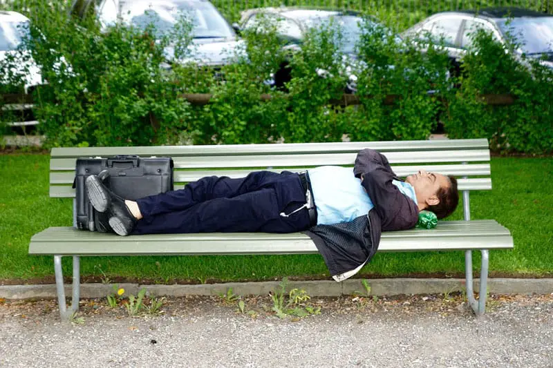 Why Business Owners Have a Hard Time Sleeping - businessman sleeping on bench