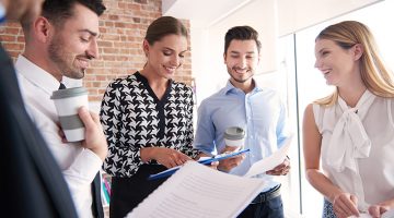 How to Attract Employees to Growing SMEs - Standing business meeting in the company