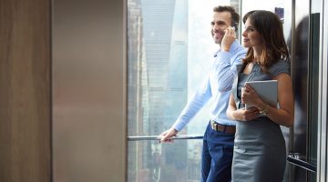 How to Take Your SME to the Next Level - Business partners in the elevator