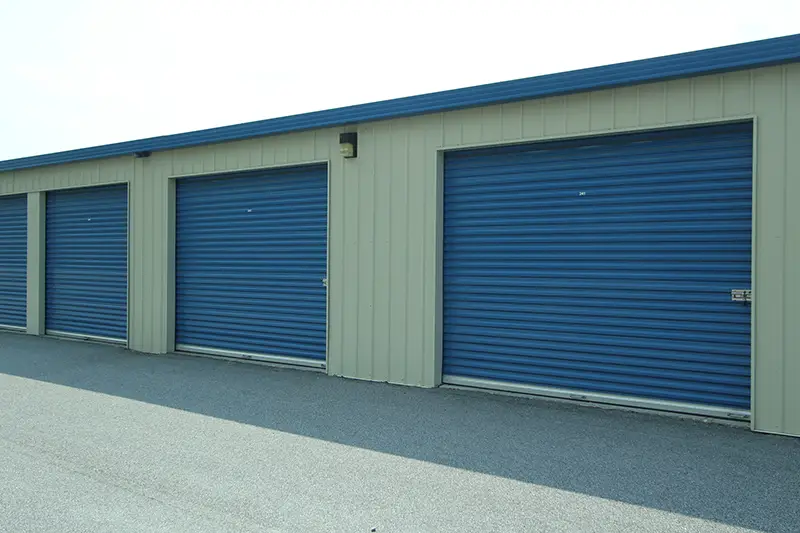 Self storage units with blue shutter doors