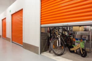 self storage unit bicycle personal belongings orange shutter