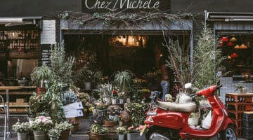 red motor scooter parked in fron of florist shop Chez Michele