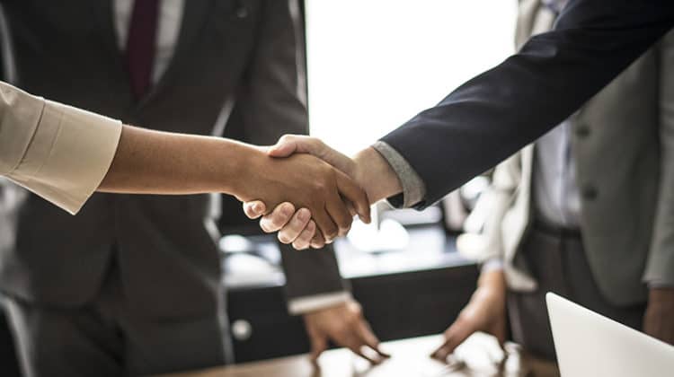 two people shaking hands