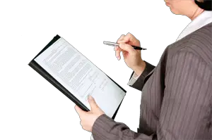 Person checking document on a clipboard