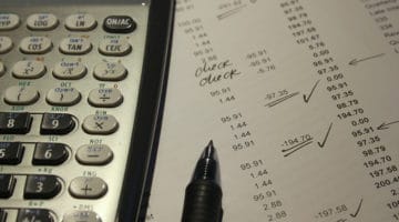 Tips for Organising Your Company’s Finances - calculator and list fo figures