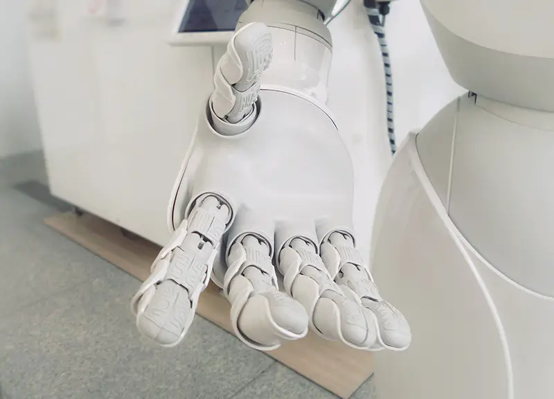 Artificial intelligence AI close up photo of white robot arm
