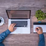 Graphic designer at work on laptop