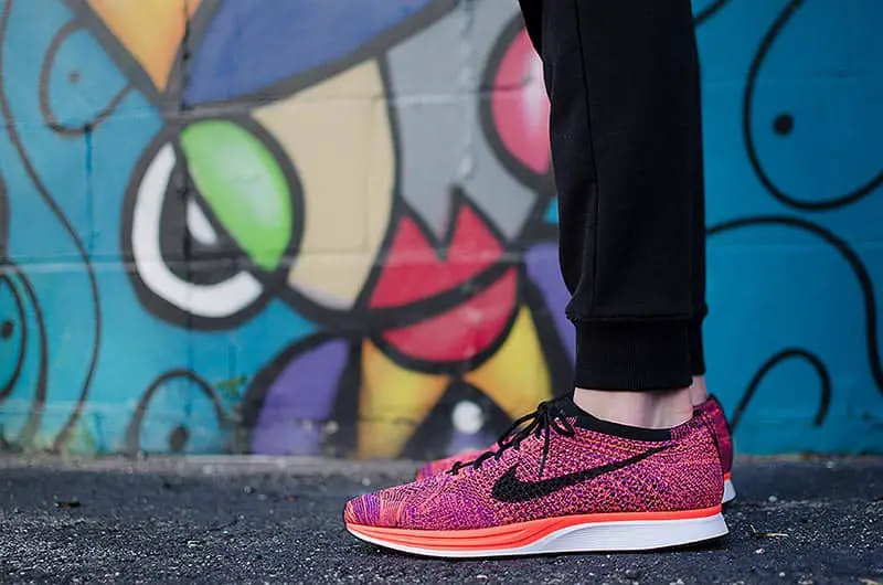 Turning Your Business into a Household Name - person showing pair of pink Nike low-top sneakers