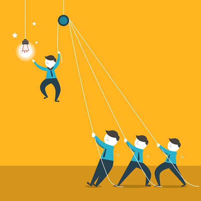 Vector of a team hoisting up a teammate to reach a lightbulb.