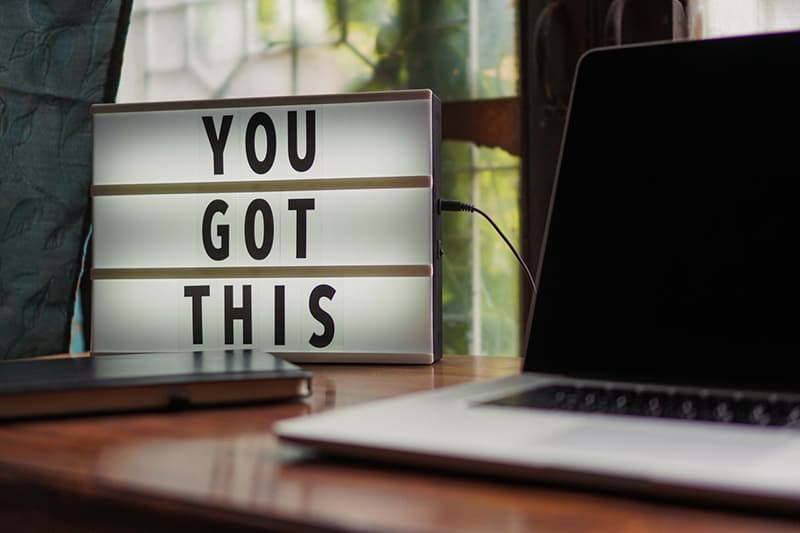Lightbox with text - you can do it - next to laptop computer -