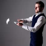 Man throwing away money - wasting money