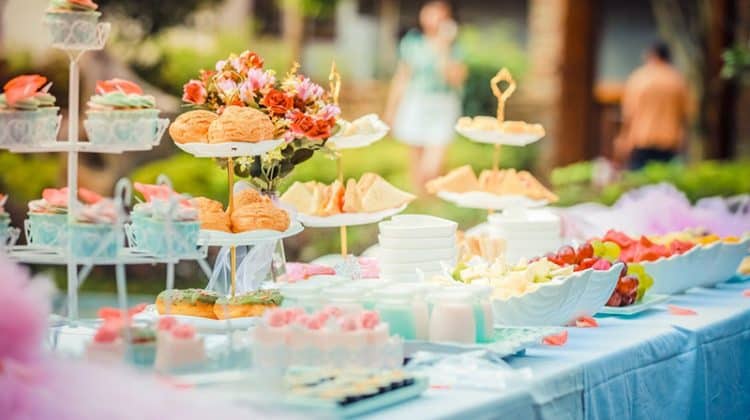 White Steel Cupcake Stand with colourful cupcakes prepared by catering service