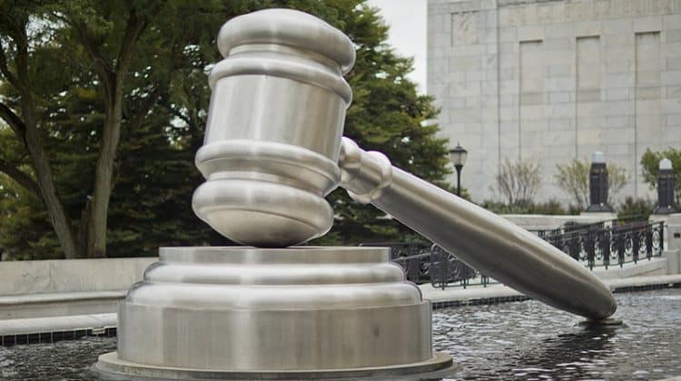 gavel statue pool outside courthouse