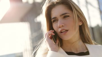 woman speaking on smartphone