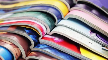 Assortment of magazines – open pages - print media – printed matter