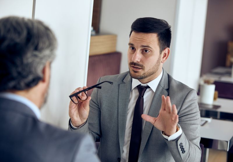 Confident Man Explaining Idea at Corporate Meeting