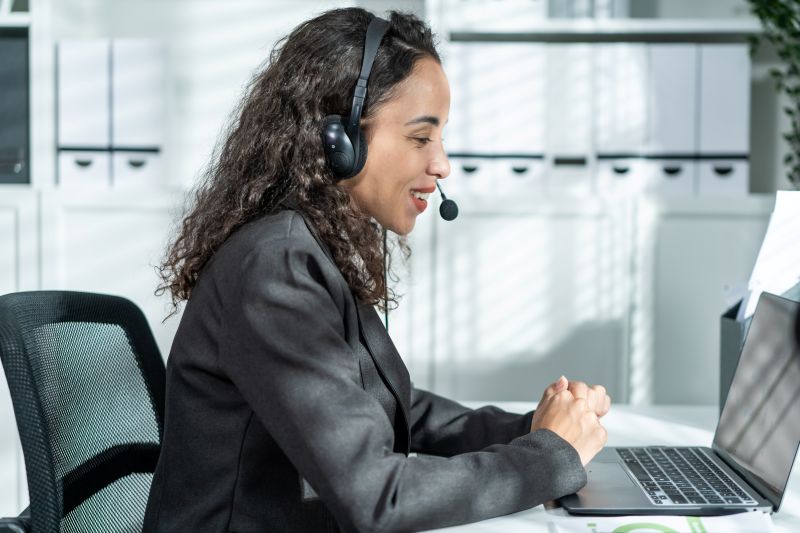 Latino beautiful business woman call center smile while work in office.