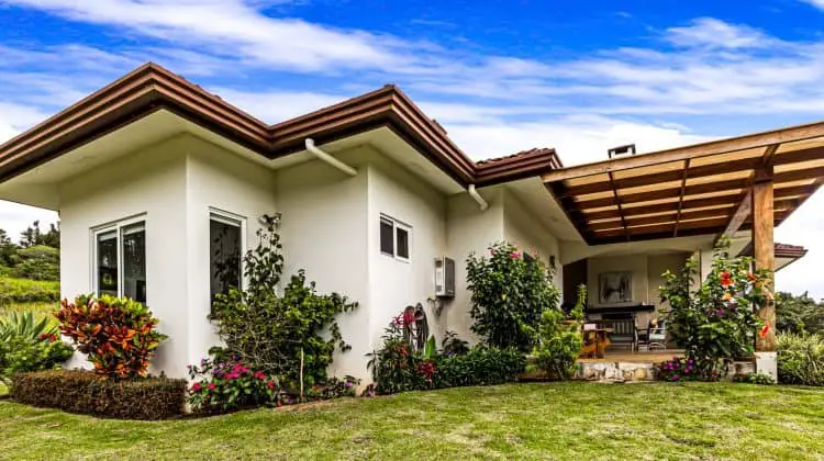 house for sale – flowers in garden - great curb appeal for quick sale