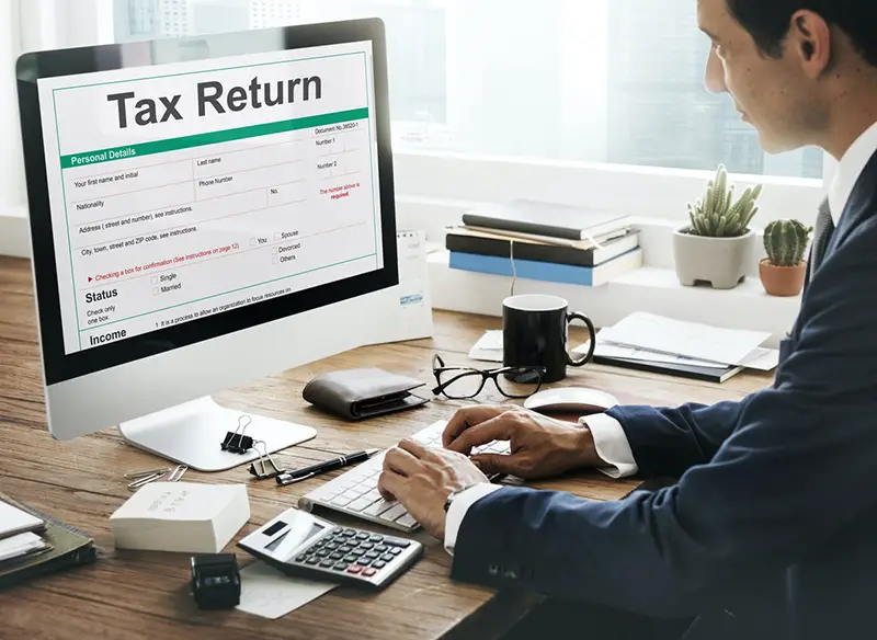 Income tax, tax return, tax deduction form on computer screen