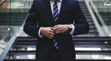 A businessman wearing business suit standing in the stairway