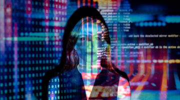 code projected over a woman – custom software development