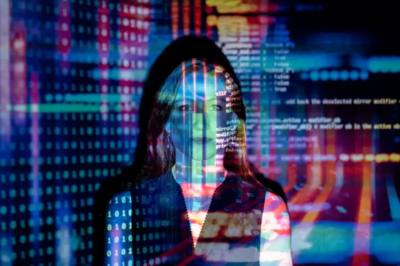 code projected over a woman – custom software development