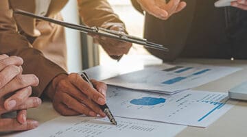 Administrator business man financial inspector and secretary making report calculating balance. Internal Revenue Service checking document. business concept