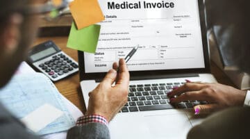 Patient Medical Invoice - medical billing document on laptop screen