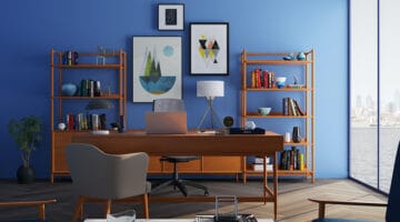 brown wooden desk with rolling chair and wooden shelves