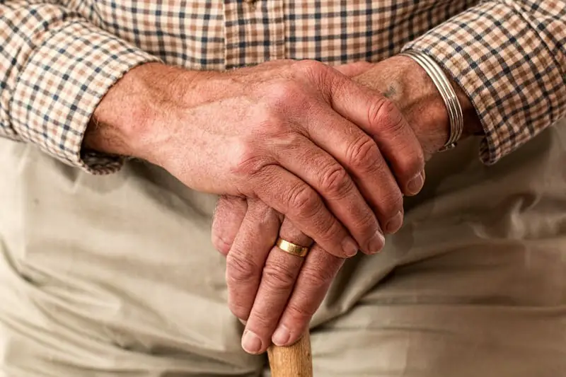 Hands on walking stick – elderly man – over 50s insurance – life insurance