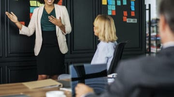 Woman in presentation speaking to her audience