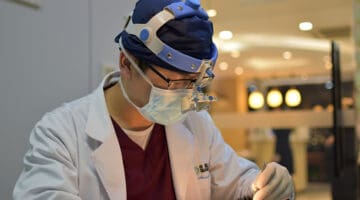 man wearing mask and head light