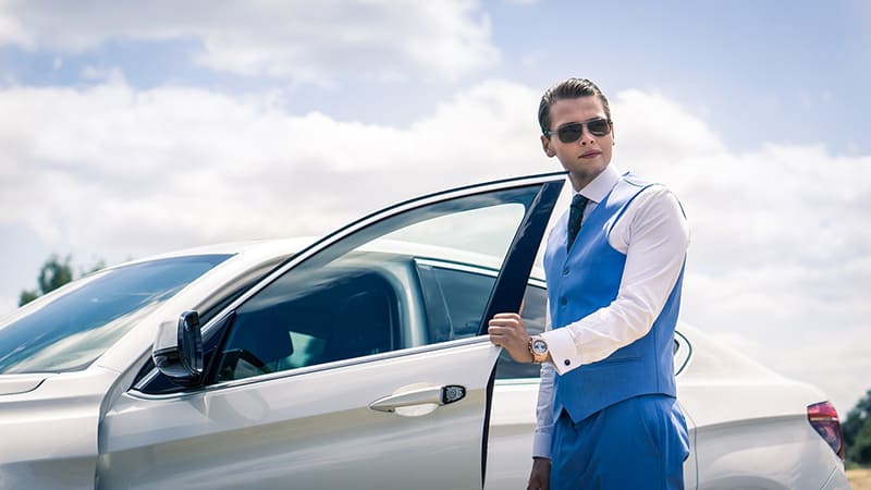 man standingnext to company vehicle - BMW